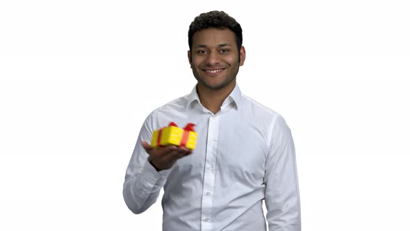 Positive Young Man Showing Gift Box