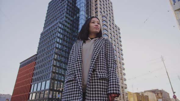 Lowangle Portrait of a Young Adult Asian Woman in Downtown District