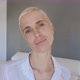Blond woman with short hair and blue eyes posing at camera - VideoHive Item for Sale