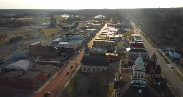 Downtown Ionia Michigan skyline with drone videoing forward.