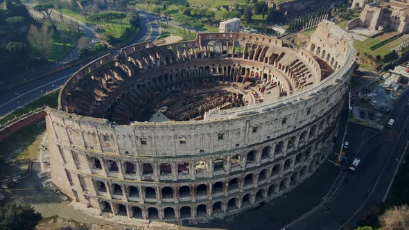 Flying over the top of the Colosseum revealing its ruins