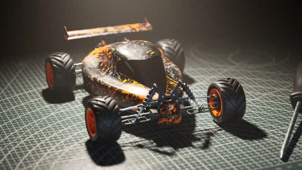 Assembled remote-controlled buggy car standing on a desk in the spotlight. 4KHD