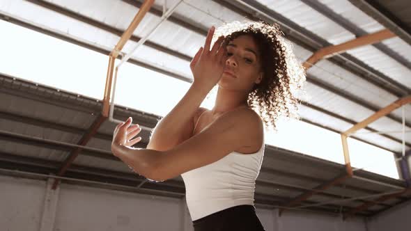 Female dancer in an empty warehouse