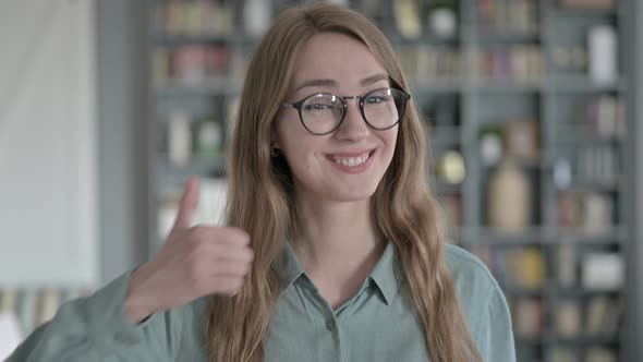 Portrait of Cheerful Woman Showing Thumbs Up