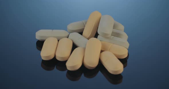 Prescription drugs - Capsules, pills, tablets on reflective background