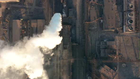 Aerial View. Industry Pipes Pollute the Atmosphere With Smoke