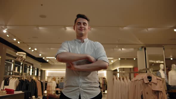 Portrait of Smiling Man in Summer Shirt Indoor of Fashionable Clothes Store