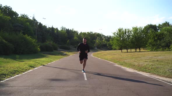 Tracking Shot of Sportsman Jog Cardio WorkoutTrainer Fitness Hard Training Before Running Marathon