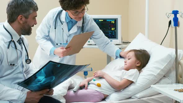 Doctors in child's hospital room