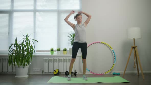 Woman Housewife Doing Fitness Exercises For Her Health