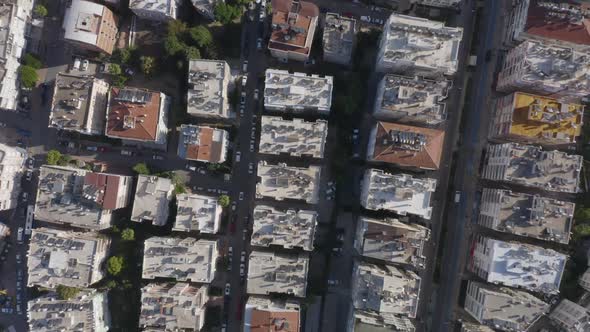 Top View of Roofs of Multistorey Buildings with Parked Cars on the Streets