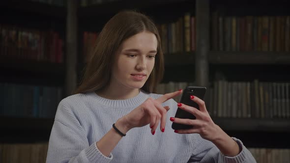 Close Up of a Caucasian Woman Browsing on Her Smart Phone Online Shopping with Maybe Not Bad Emotion