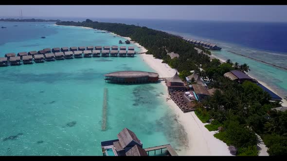 Aerial drone shot nature of tropical coast beach holiday by turquoise ocean and white sandy backgrou