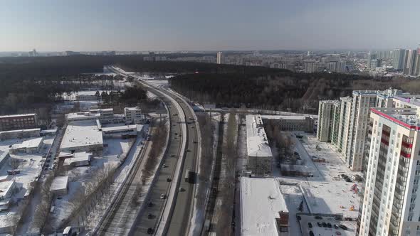 Aerial view of Highway with car traffic in the winter city 07