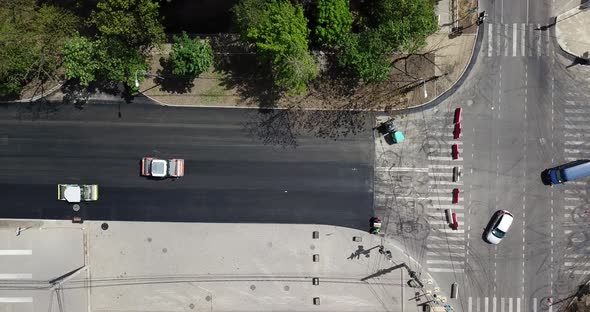 Aerial Top Down View of Asphalting Construction Works with Commercial Repair Equipment Road Roller