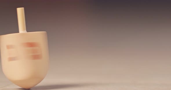 Slow motion of a Hanukka dreidel spinning