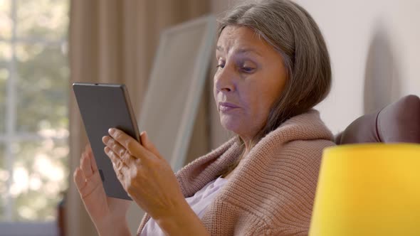 Sick Aged Woman Calling Doctor on Tablet Showing Temperature Measurement Results