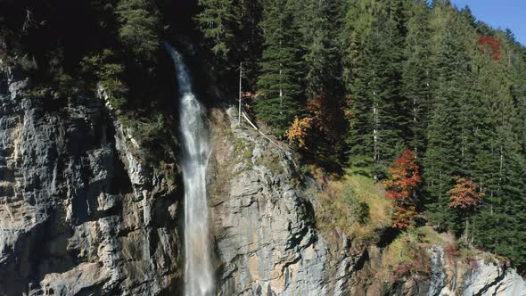 Aerial View of a Waterfall and Rainbow in the Village of Lauterbrunnen, Switzerland in the Fall