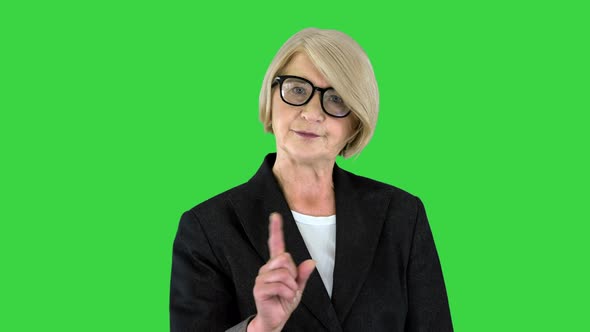 Strict Teacher Expressing Her Discontent Wags Her Finger on a Green Screen Chroma Key