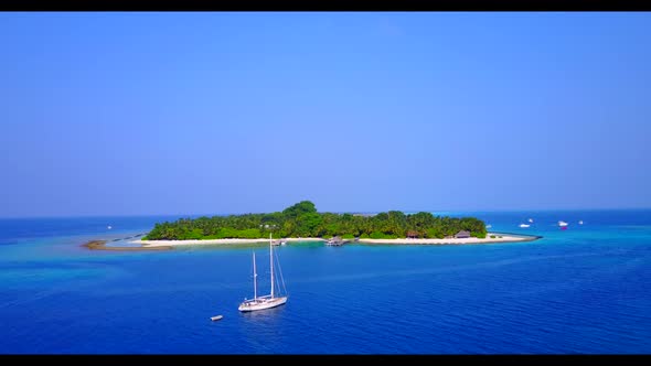 Aerial view tourism of idyllic lagoon beach adventure by clear ocean with bright sandy background of