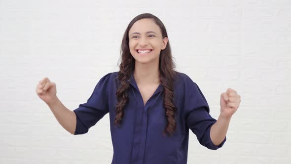 Excited Indian girl cheering