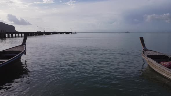 Aerial view from drones of fishing boats in the shore during low tide.