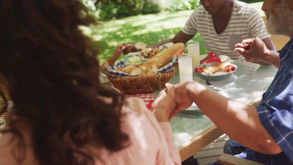 Multi-generation African American family spending time in garden together