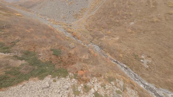 Aerial Dive View From Sport Fpv Drone From Mountain Peak on Cliff Stones