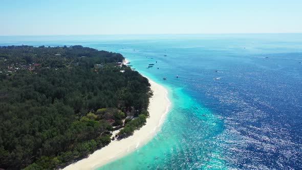 Aerial view of tropical Islands And Coral Reef,  summer vacation background. Boats moored in the cal