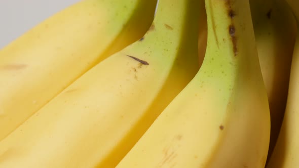 Tasty banana fruit background fresh arranged in a row 4K 2160p 30fps UltraHD tilt footage - Musa acu