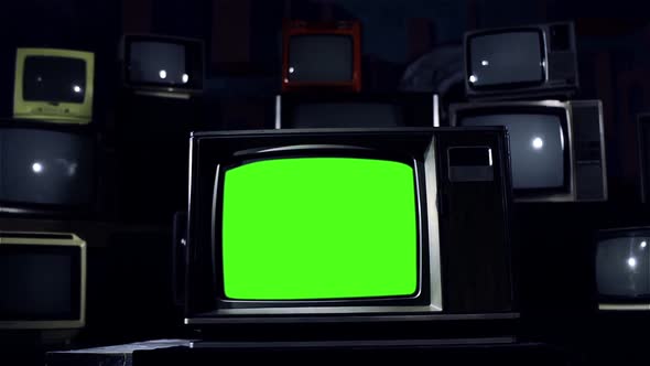 Vintage TV with Green Screen and a Retro TV Stack Installation. Blue Tone.