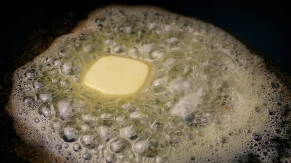 Butter Melts Into Bubbles In Frying Pan