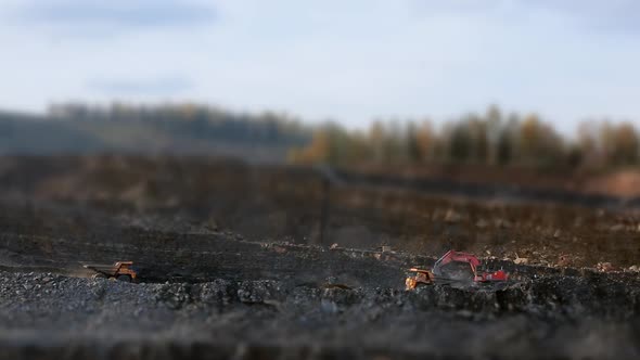 Tilt-shift Panorama Tipper Goes To the Excavator