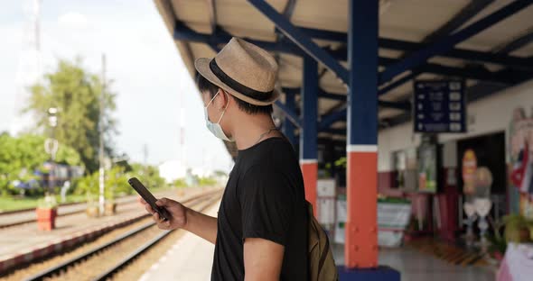 Man walking and looking a watch