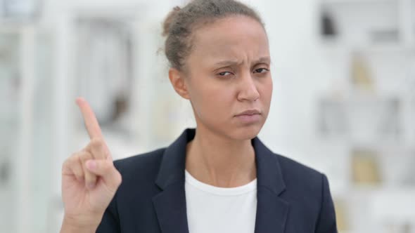 Portrait of Attractive African Businesswoman Saying No By Finger