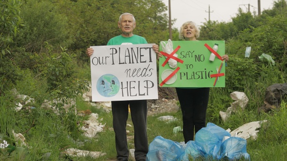 Senior Volunteers with Protesting Posters Our Planet Needs Help, Say No To Plastic. Nature Pollution