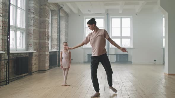 Ballet Trainer And Little Student Dancing Together