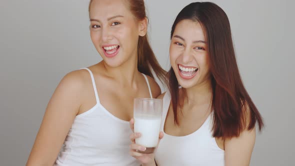 Asian young woman drinking milk.Beautiful Asian pregnant woman drink milk