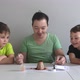 Dad and Sons Making Chemical Experiments - VideoHive Item for Sale