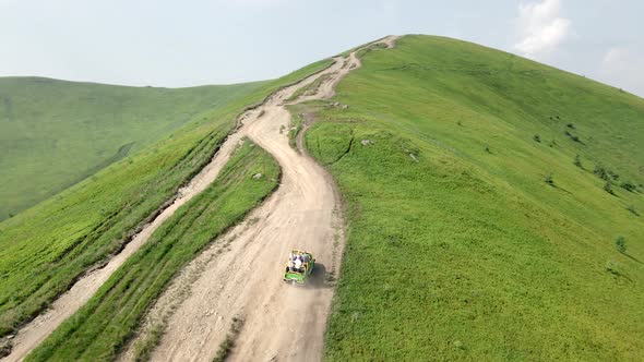 Aerial View Suv Vehicle Going Up By Hill to the Top of Mountain