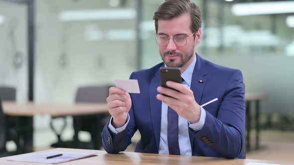 Businessman Making Successful Online Payment on Smartphone