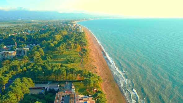 shooting from drone, on outskirts of Kobuleti with view of sea coast and beach.