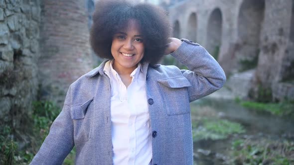 Fashion Street Style Portrait of Attractive Young Natural Beauty African American Woman with Afro