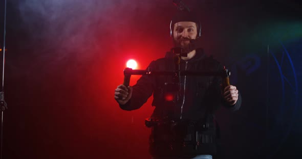 Bearded Man in Harness for Camera Equipment