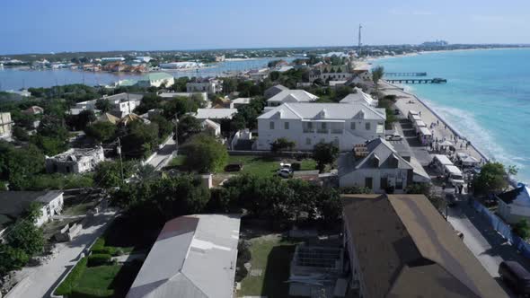 Aerial footage of houses and bay in Cockburn Town, Grand Turk, Turks and Caicos