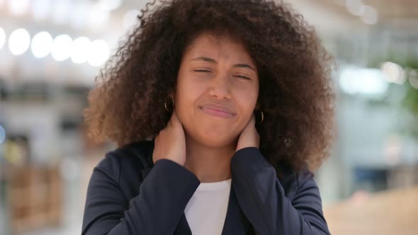 Stressed Young African Businesswoman Having Neck Pain 