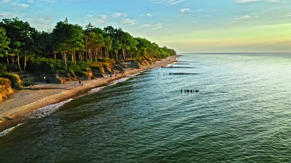 Stunning beach by Baltic sea at sunset, aerial view