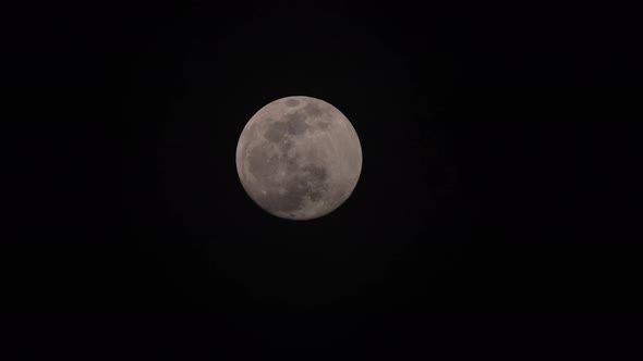 full moon moving through sky as clouds pass over 1000x speed