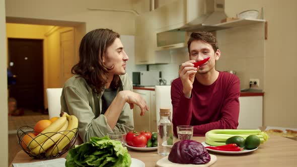 Two Men are Talking About Vegetables and Smiling