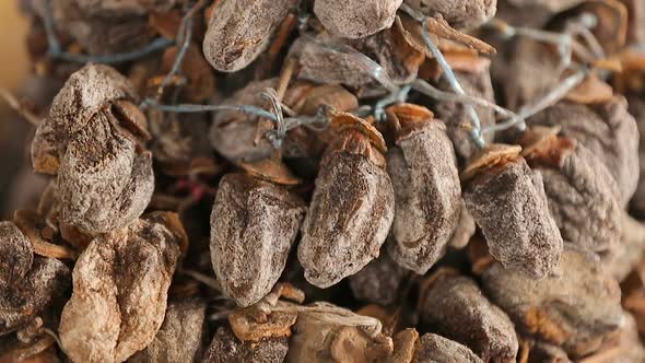 Dried persimmon on sale on Georgia market, healthy tasty dessert, fruit closeup